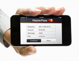 A person holding a mobile phone with MasterPass from MasterCard on it