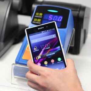 A NFC mobile phone making payment