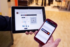 A picture of a mobile phone and a tablet using MasterCard's MasterPass