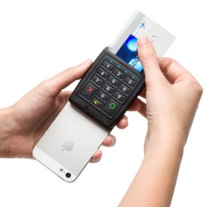 A phone with a Verifone Chip and PIN reader attached