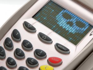 A POS with a skull and crossbones on the LCD screen
