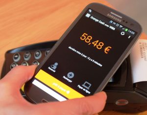 A mobile phone making an Orange cash transaction