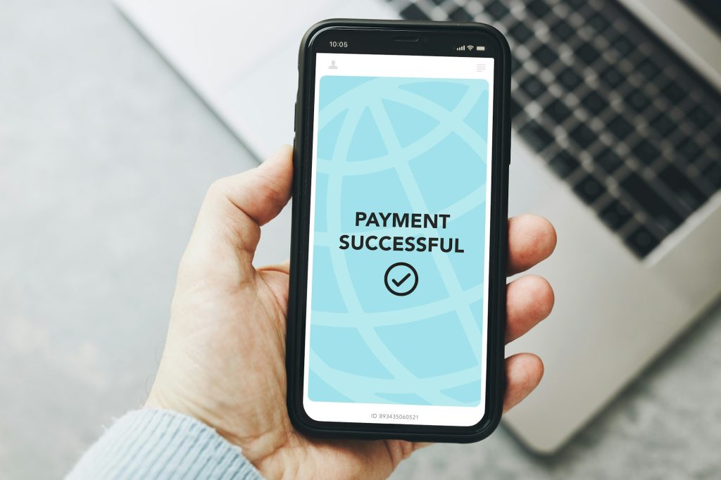 Man paying with smartphone for online shopping. Paying using mobile payment app. Online payment