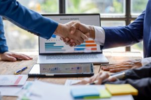 Business handshake for teamwork of business merger and acquisition,successful negotiate,hand shake,